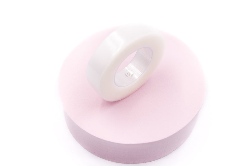 Our High-quality PE Clear Tape is ideal for holding bottom lashes and keeping eye gel patches in place while lashing. It can also be used to lift the upper eyelid slightly so that natural lashes can be seen more clearly, which allows for easier isolation and application. Key Features: - Easy to tear - Hypoallergenic - Colour: Clear - Latex Free - Size: 1.25x900cm
